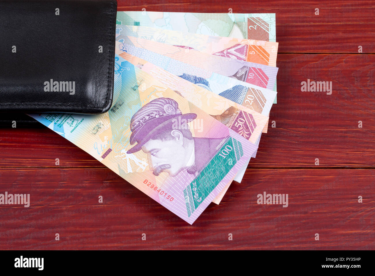 Venezuelan Bolivares in the black wallet Stock Photo Alamy