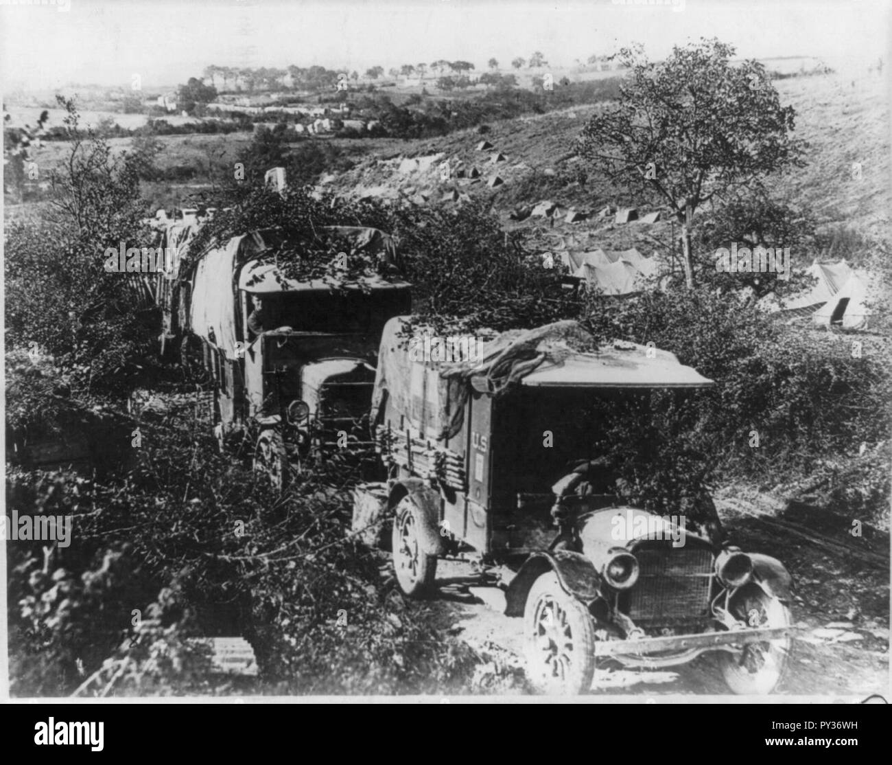 Camouflaged U.S. Army trucks at bivouac in France. 1918 Stock Photo