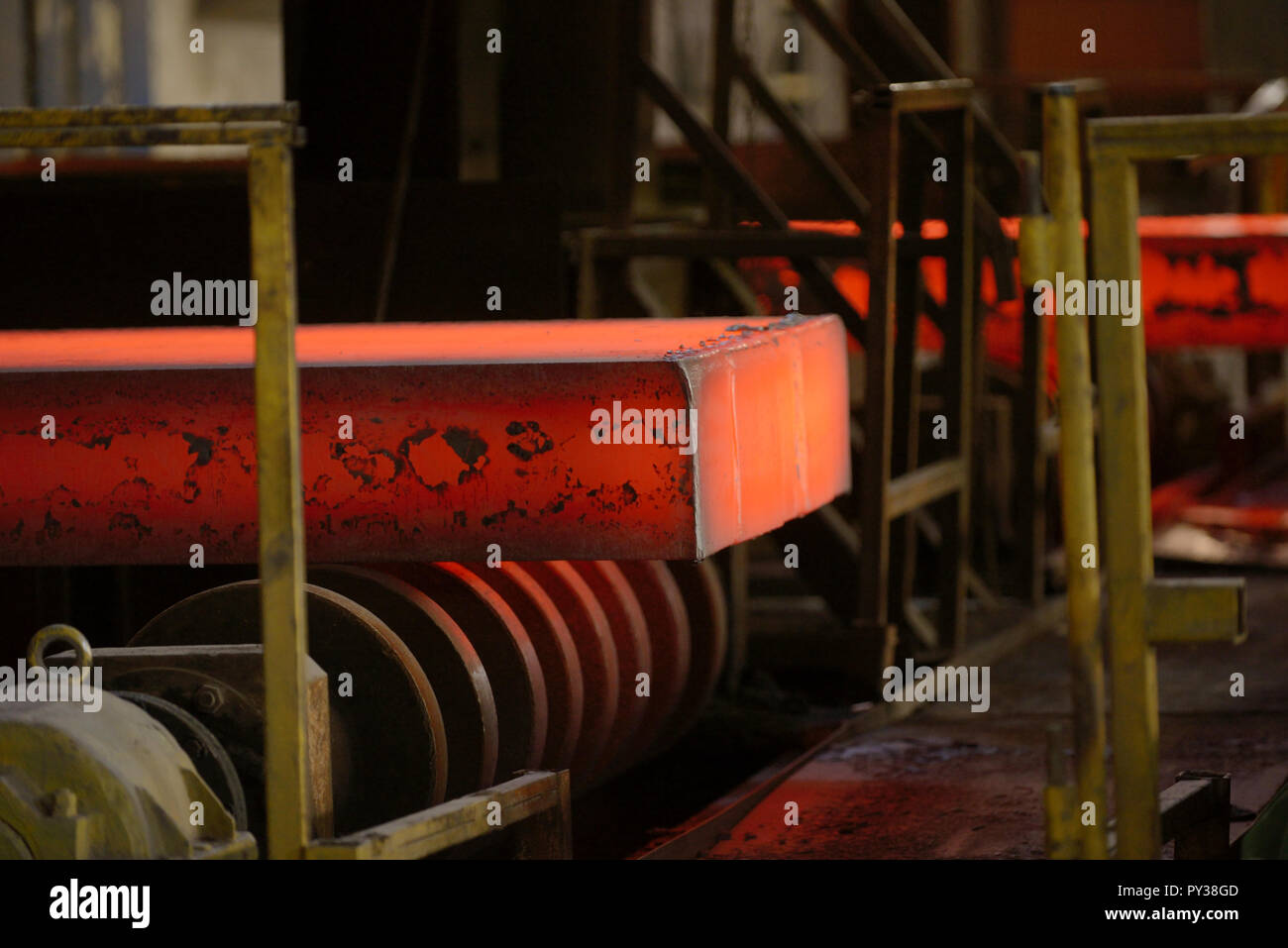 Hot steel on conveyor in steel plant Stock Photo