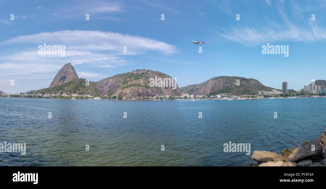 Panoramic view of plane flying over Sugar Loaf Mountain - Rio de Janeiro, Brazil Stock Photo