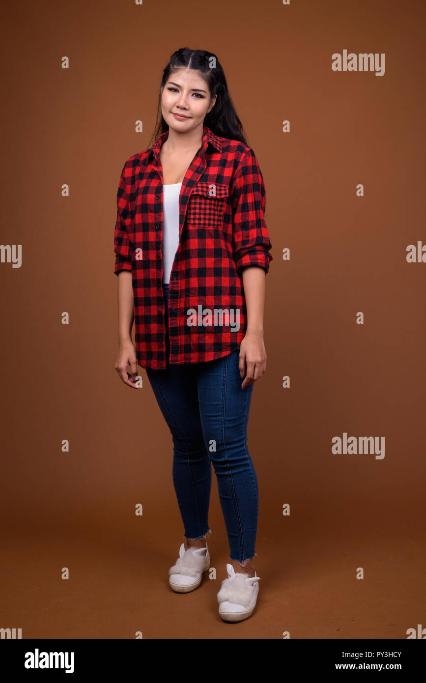 Studio portrait of young beautiful Asian woman Stock Photo - Alamy