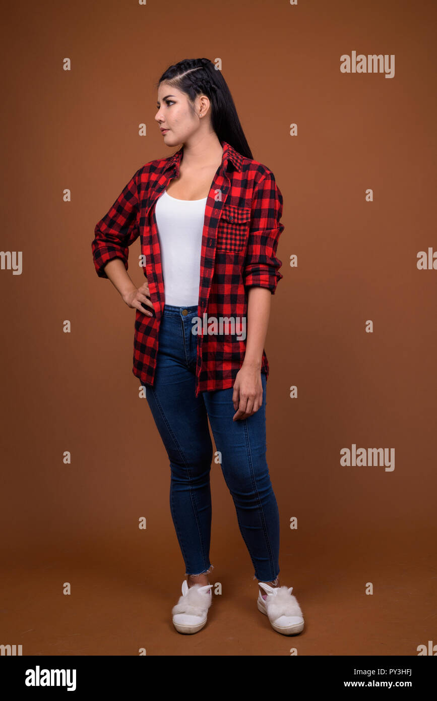 Studio portrait of young beautiful Asian woman Stock Photo - Alamy