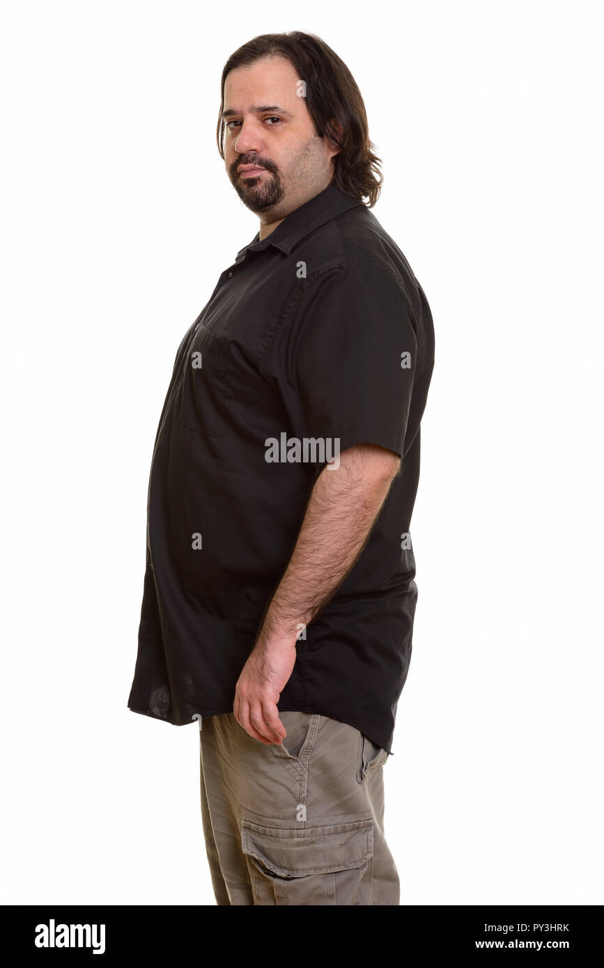 Fat Caucasian man profile view looking at camera Stock Photo