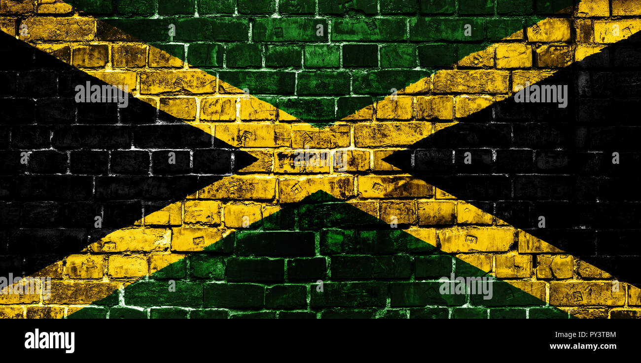 National flag of Jamaica on a brick background. Concept image for Jamaica: language , people and culture. Stock Photo