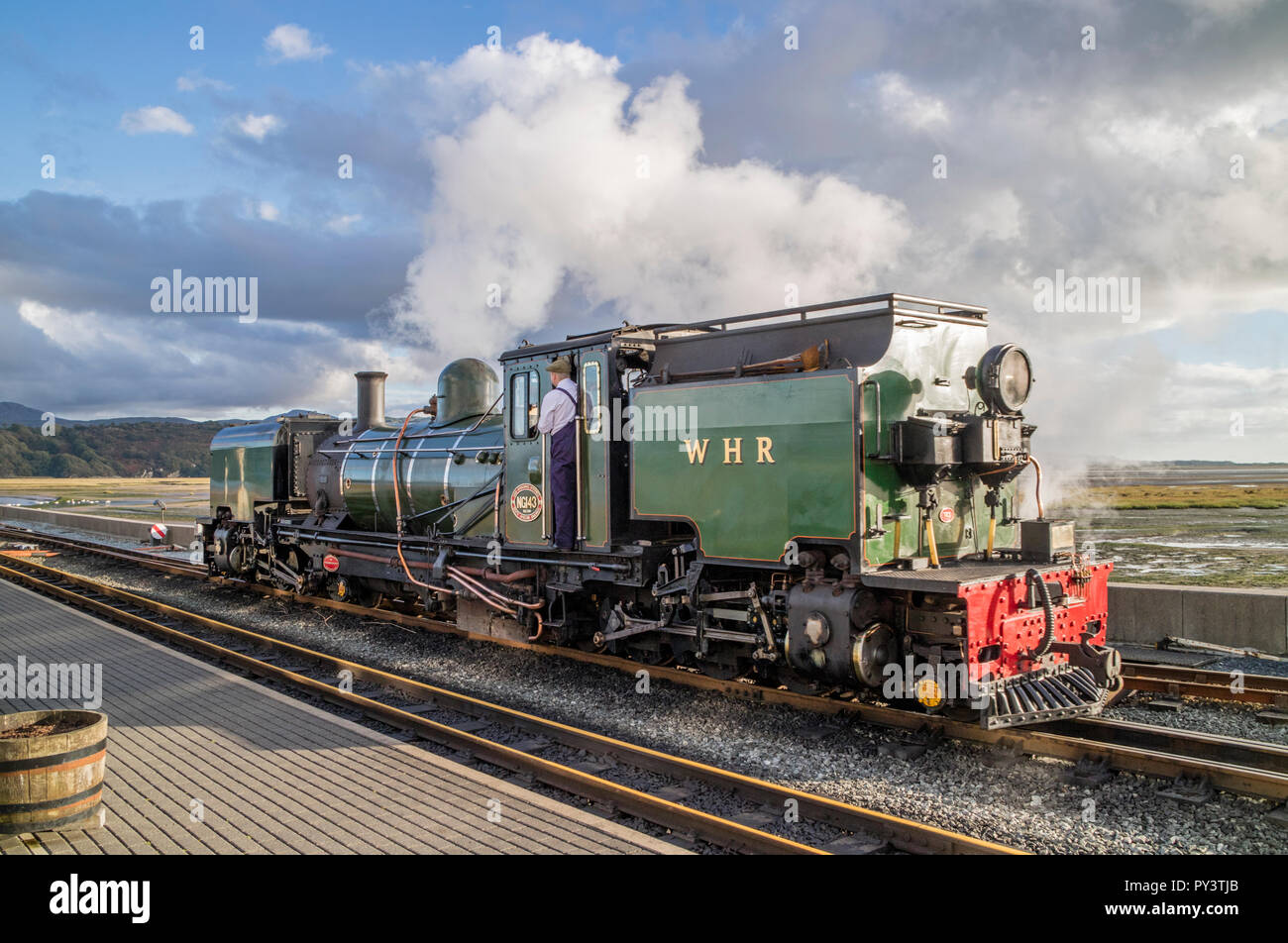Steam train crossing the Cob, at Porthmadog, Snowdonia, North Wales, UK Stock Photo