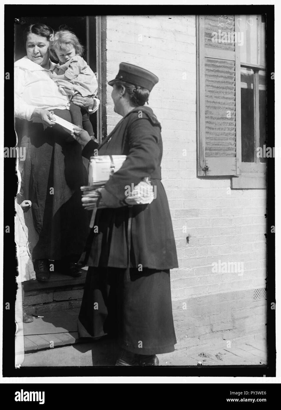 Mail carrier delivering mail Black and White Stock Photos & Images Alamy