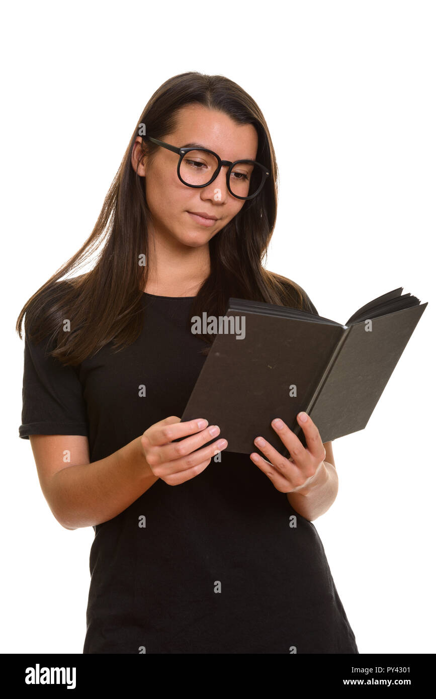 Young beautiful Caucasian student woman reading book Stock Photo