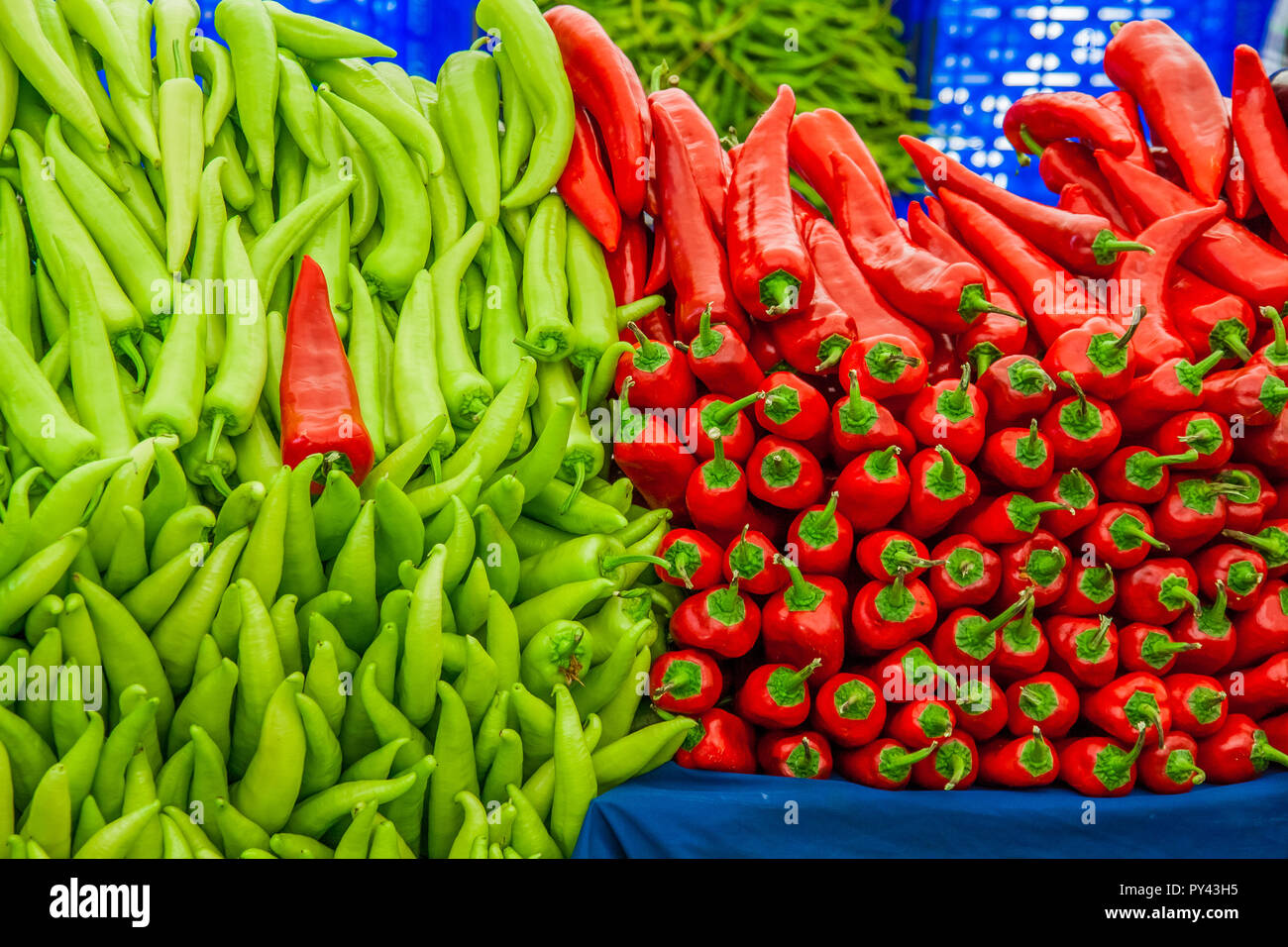 Red and green peppers on sale in a market Stock Photo - Alamy