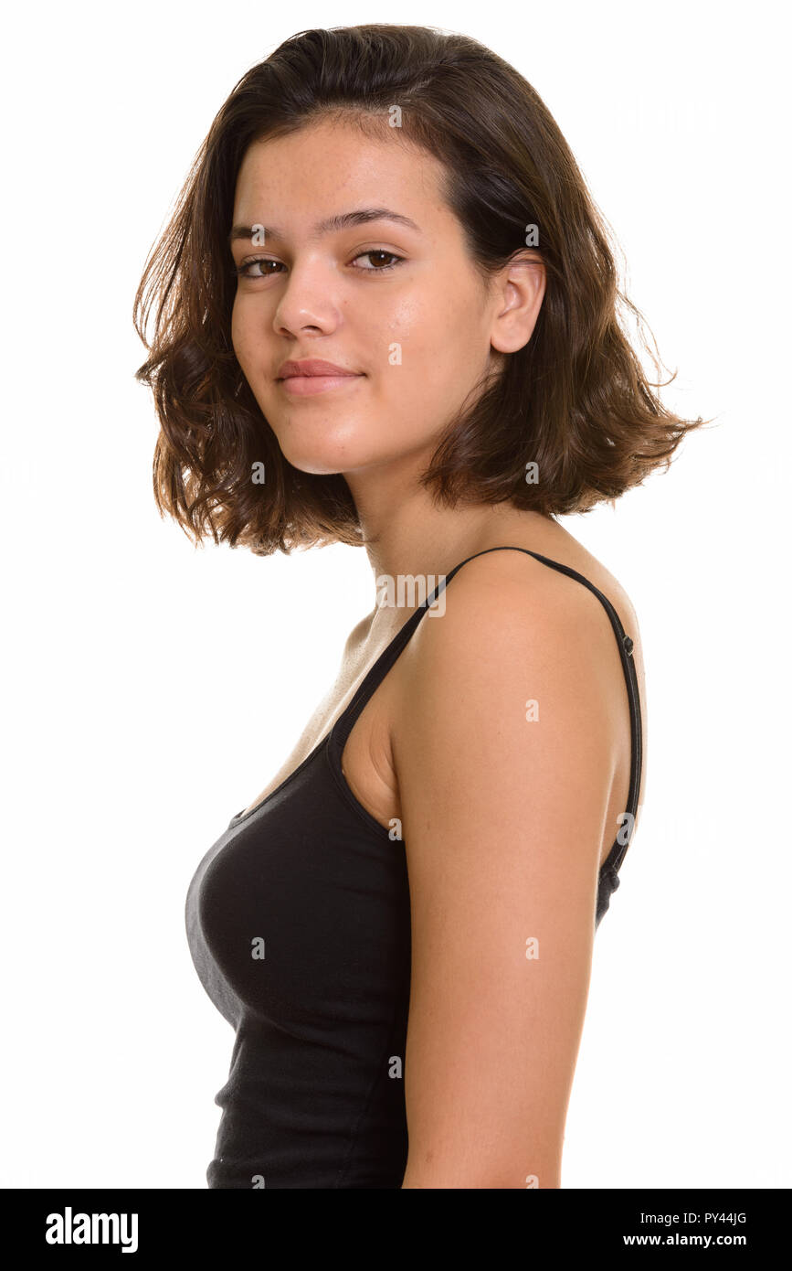 Profile view of teenage girl looking at camera Stock Photo