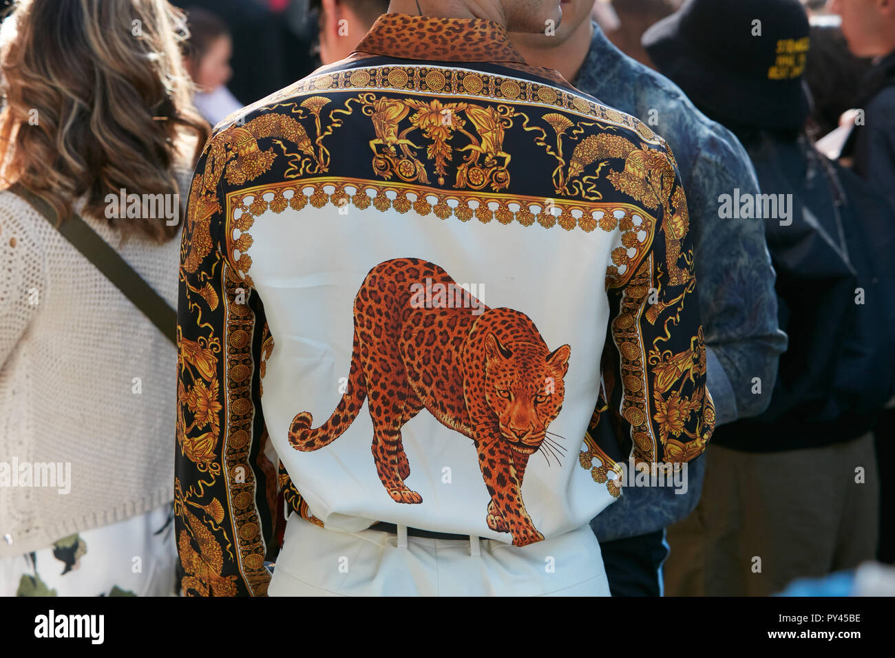 MILAN, ITALY - SEPTEMBER 23, 2018: Man with Versace shirt with golden  decorations and leopard design before Giorgio Armani fashion show, Milan  Fashion Stock Photo - Alamy