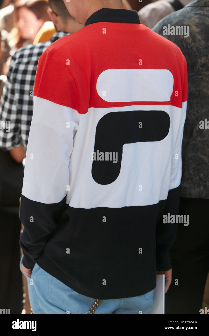 MILAN, ITALY - SEPTEMBER 23, 2018: Man with Fila sweater in red, white and  black colors before Giorgio Armani fashion show, Milan Fashion Week street  Stock Photo - Alamy