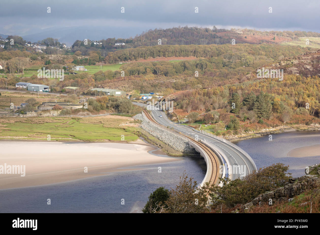 The new Pont Briwet bridge (2014) carrying the Cambrian Coast railway line and traffic over the Dwyryd Estuary, North Wales Stock Photo