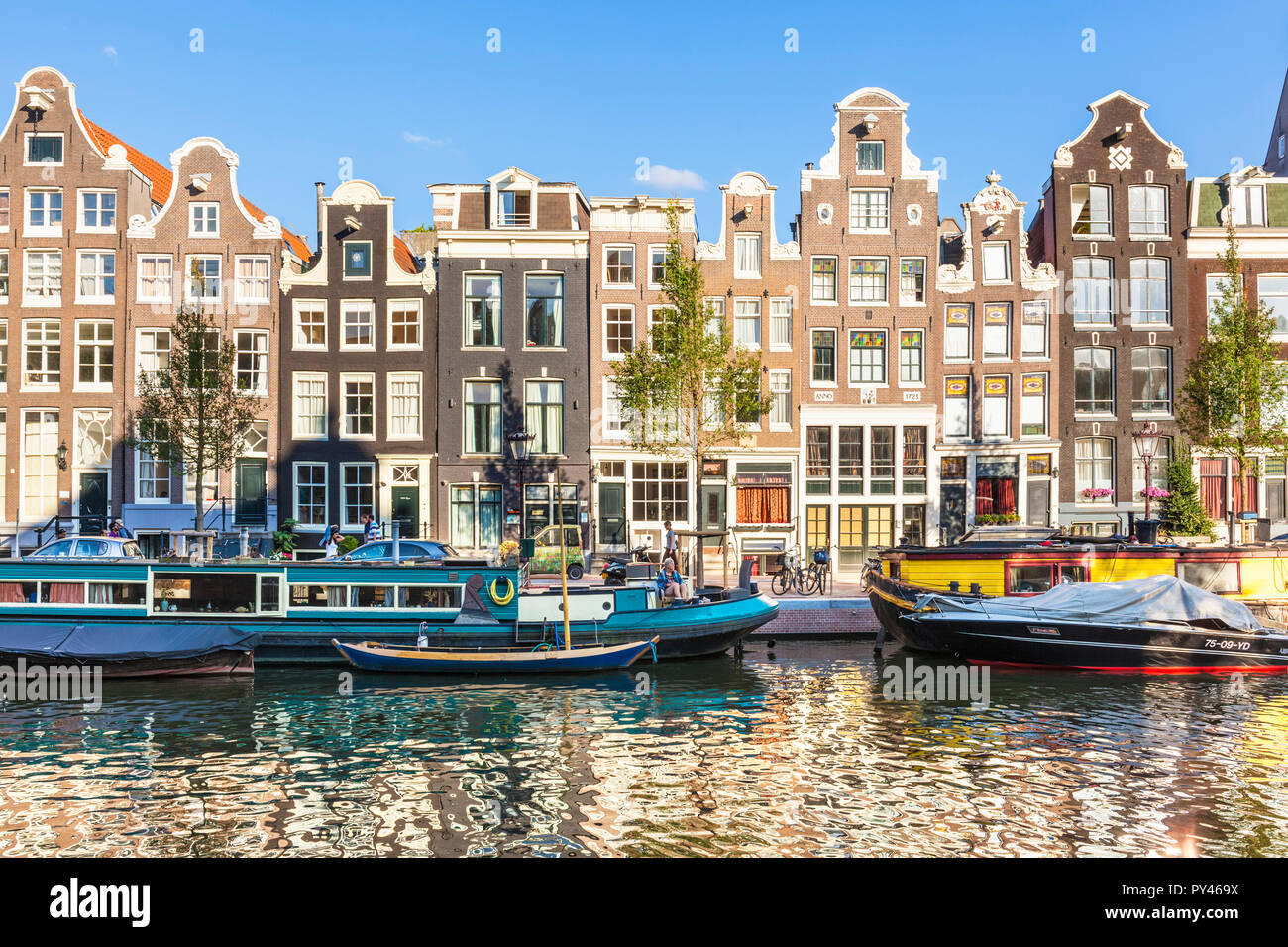 Amsterdam houses with dutch architecture by the canal Amsterdam Holland Netherlands EU Europe Stock Photo