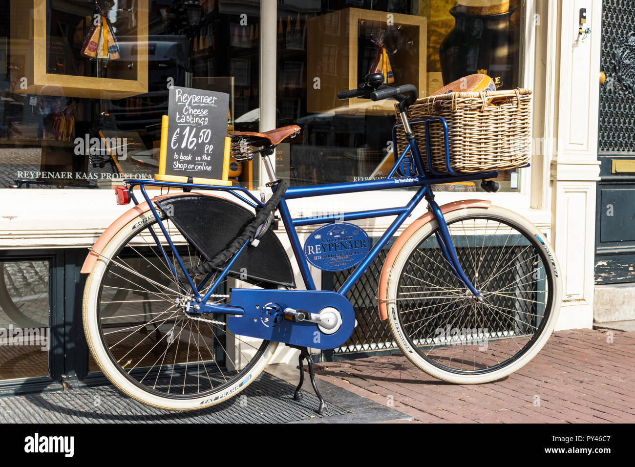 Amsterdam Reypenaer Tasting Room Singel Amsterdam Cheese tasting rooms Advertising bicycle propped up outside shop Holland The Netherlands EU Europe Stock Photo