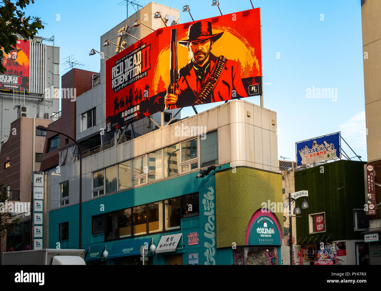 Red Dead Redemption II Game new release billboard in Tokyo Harajuku. Billboards corner Harajuku St and Meji St on Moshi Moshi Box building. Oct 2018 Stock Photo