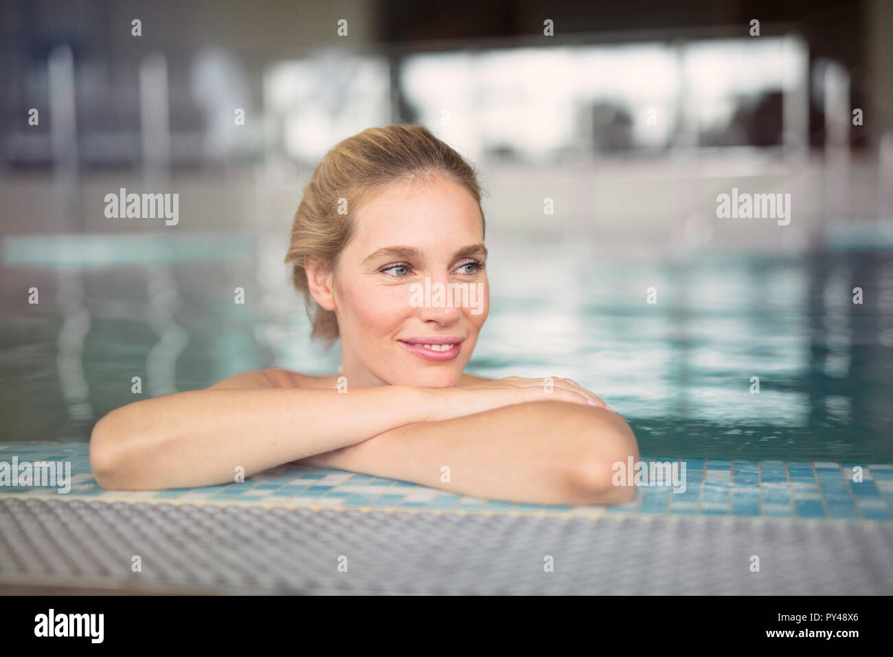 Portrait of beautiful woman relaxing in swimming pool Stock Photo - Alamy