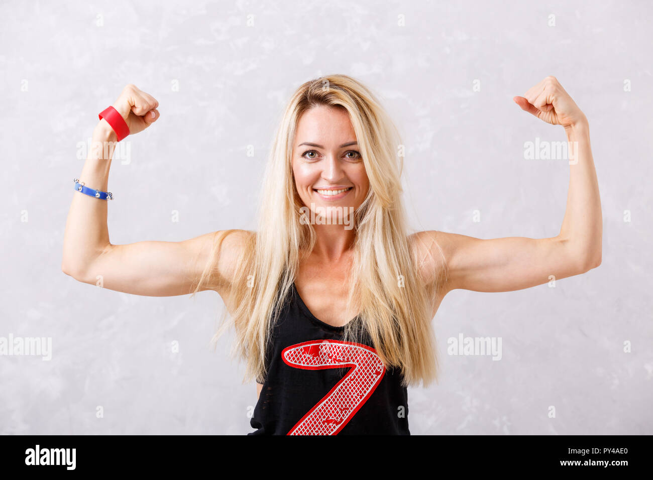 Portrait of Young Fitness Woman Shows Biceps Stock Image - Image of  athlete, athletic: 59823083