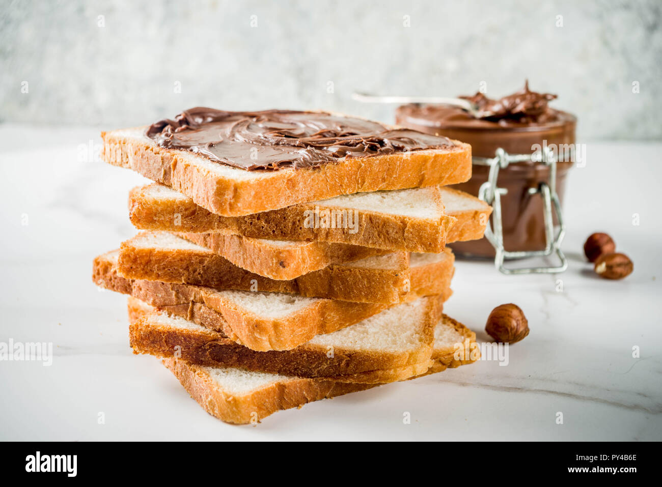 Chocolate and hazelnut spread sandwiches with white toasted bread