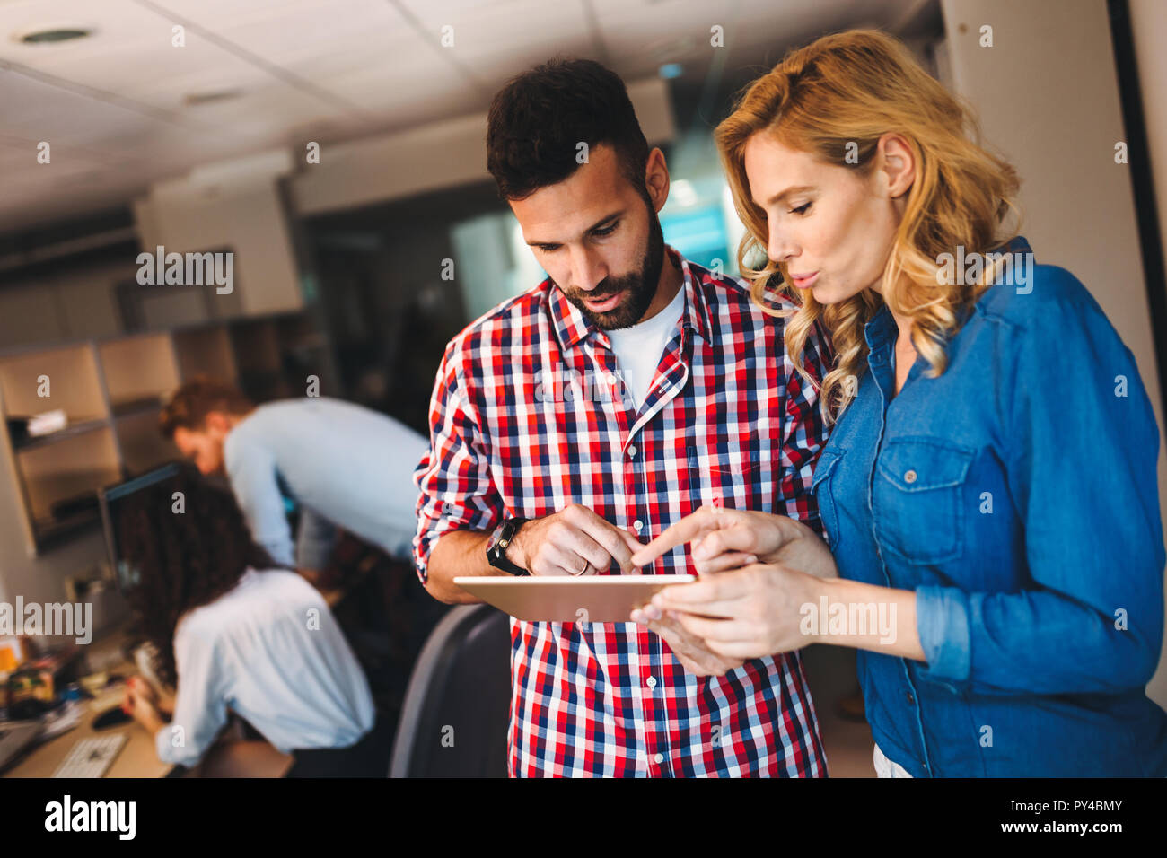 Portrait of software engineers using digital tablet Stock Photo