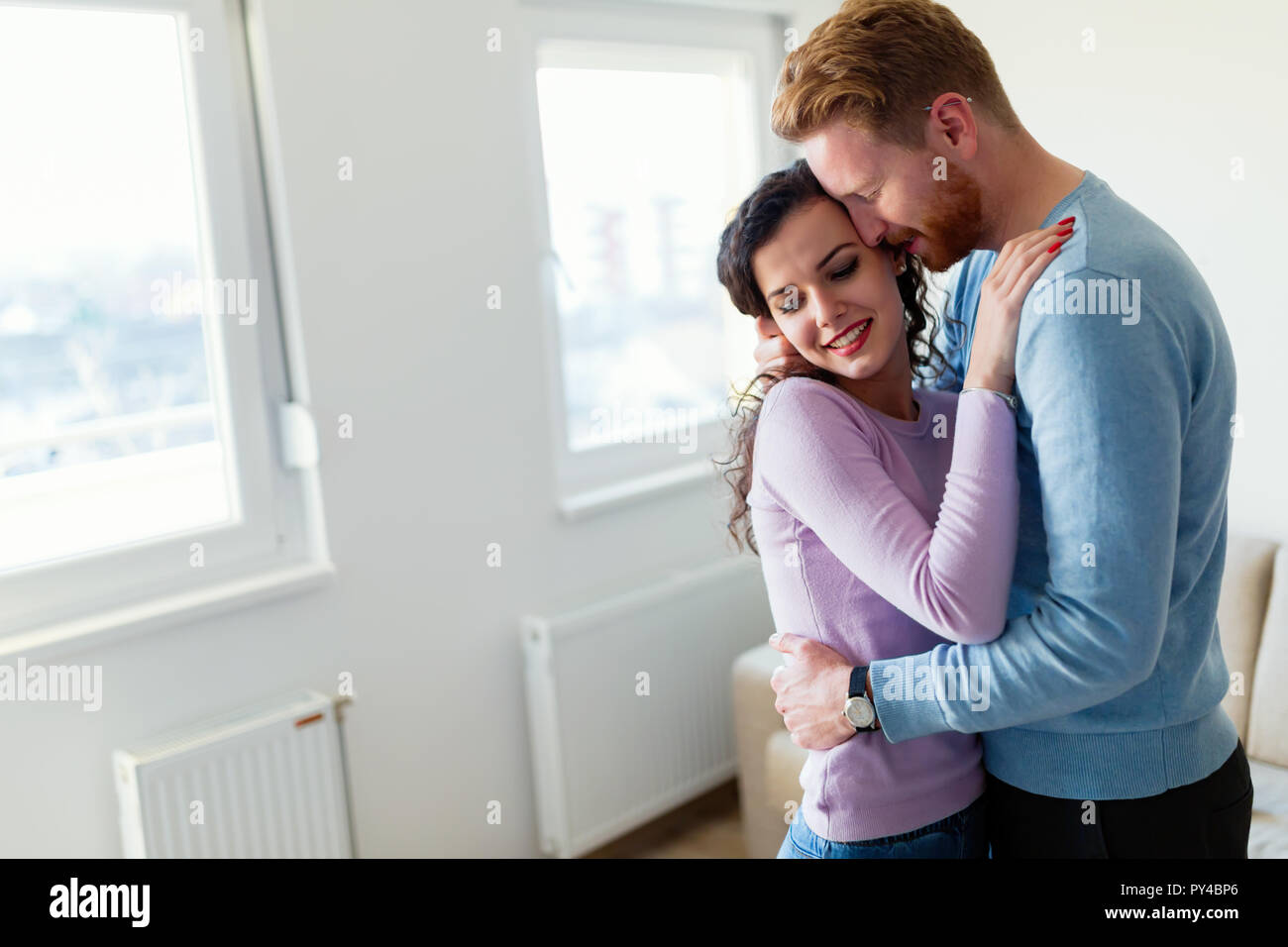 Young happy couple having romantic times at home Stock Photo