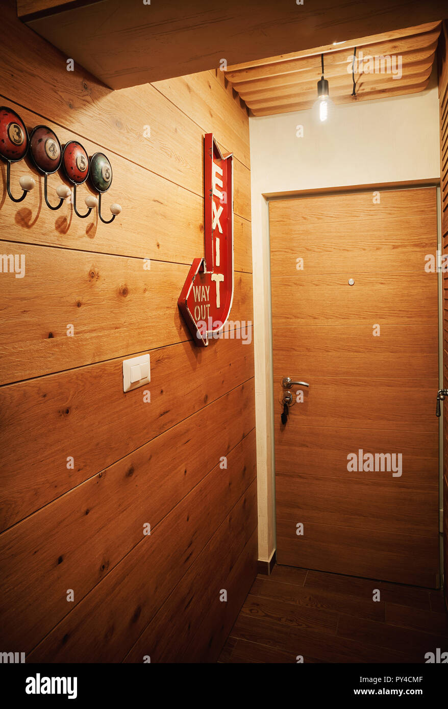 Wooden walls of small apartment entrance, decoration details. Stock Photo
