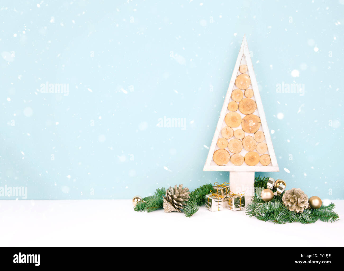 Christmas wooden tree over dark light blue background Stock Photo - Alamy