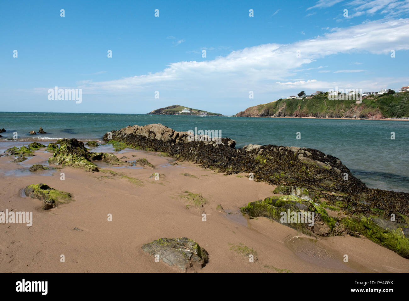 Looking across from the estuary of the River Avon at Bantham Beach to Burgh Island on a fine summer day, Devon, July Stock Photo