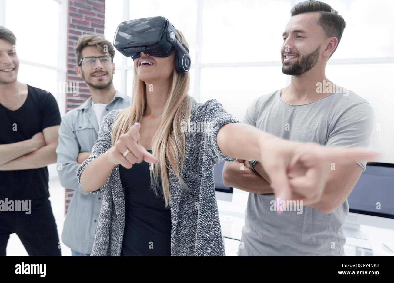 woman standing in the office with VR glasses Stock Photo