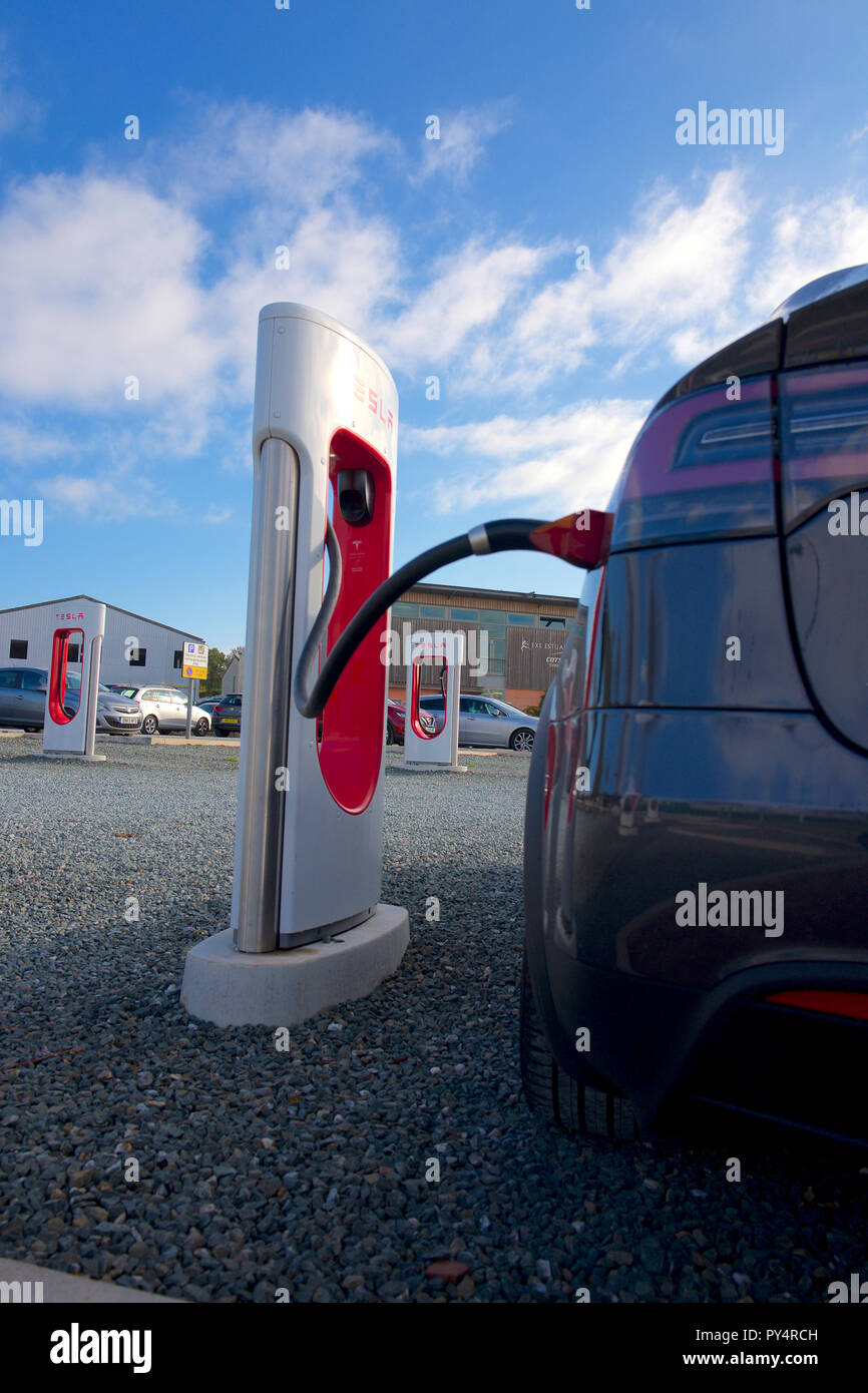 Charging car at Tesla. Electric charging point, UK Stock Photo