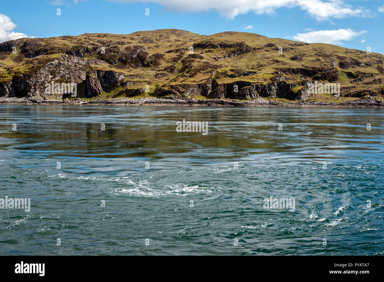 Tidal whirlpool in the Gulf of Corryvreckan between islands of Jura (seen) and Scarba in inner western isles Argyll & Bute Scotland UK Stock Photo