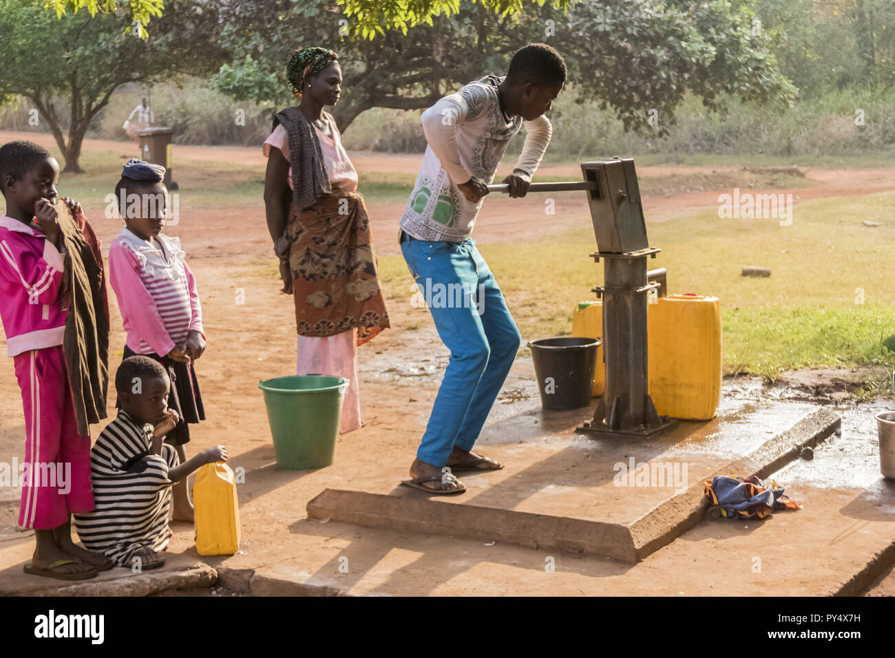 Ghana, Accra January 02, 2017 African Ghana family take water at the