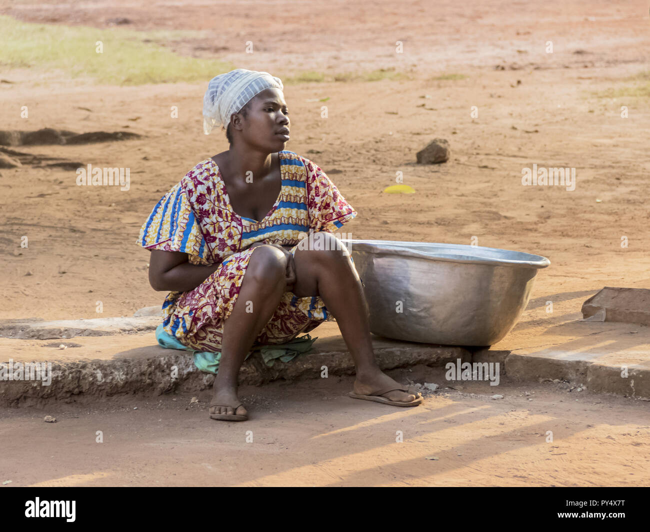 Ghana, Accra January 02, 2017 African Ghana woman waiting to take water at the well in Accra