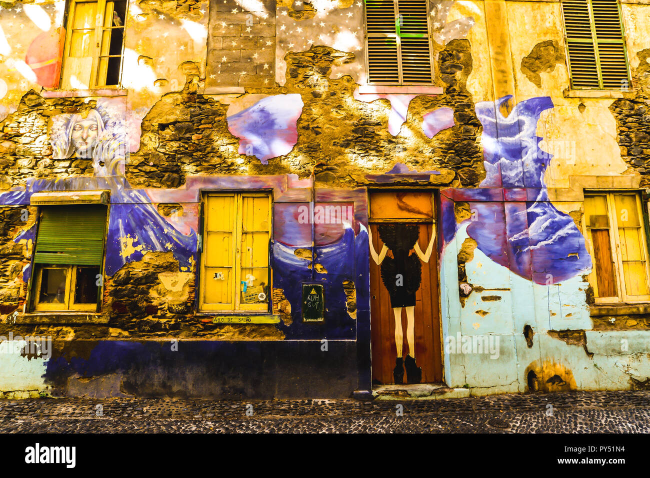 A brightly colorful but decaying wall in Funchal - Maderia, Portugal Stock Photo