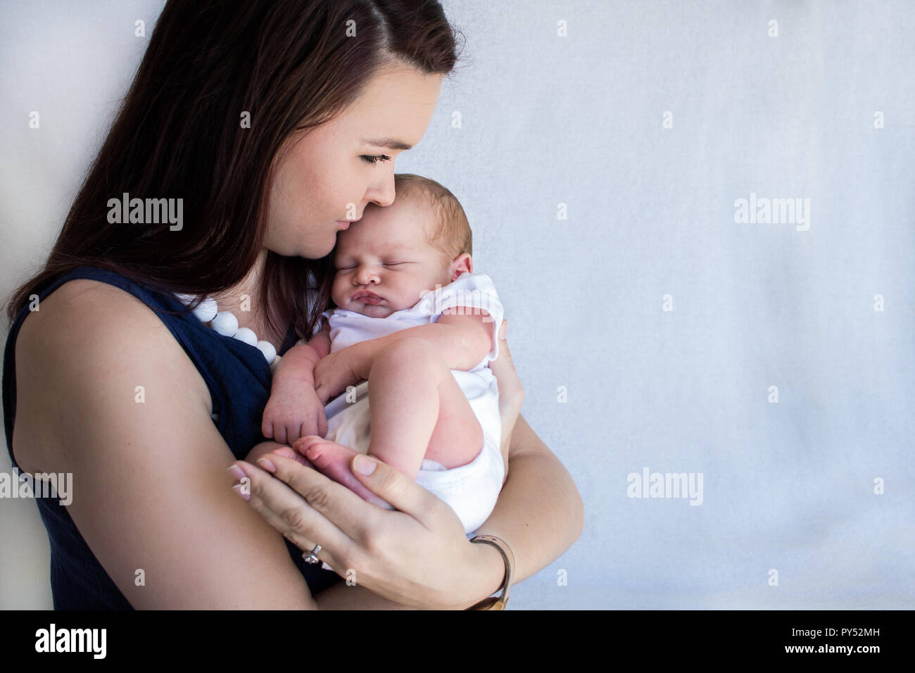 Mother holding newborn baby hi-res stock photography and images - Alamy