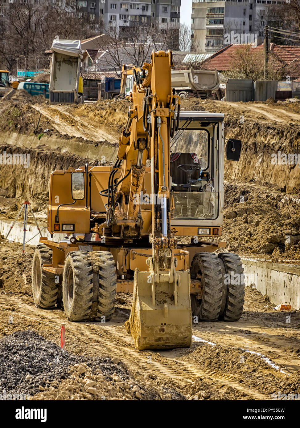 Big yellow stopped excavator at the construction site Stock Photo - Alamy