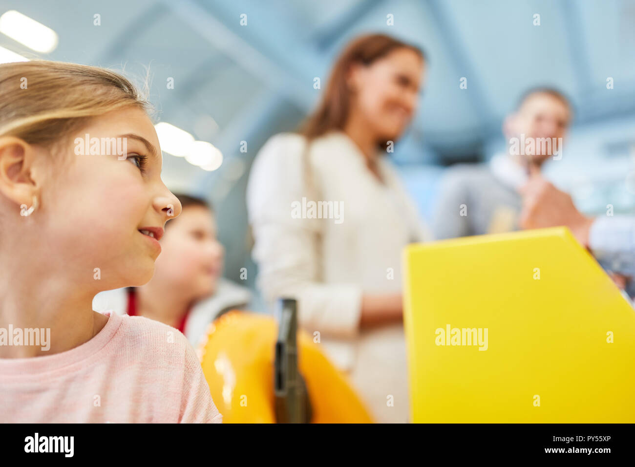Family and children checking the boarding pass at the check-in counter ...