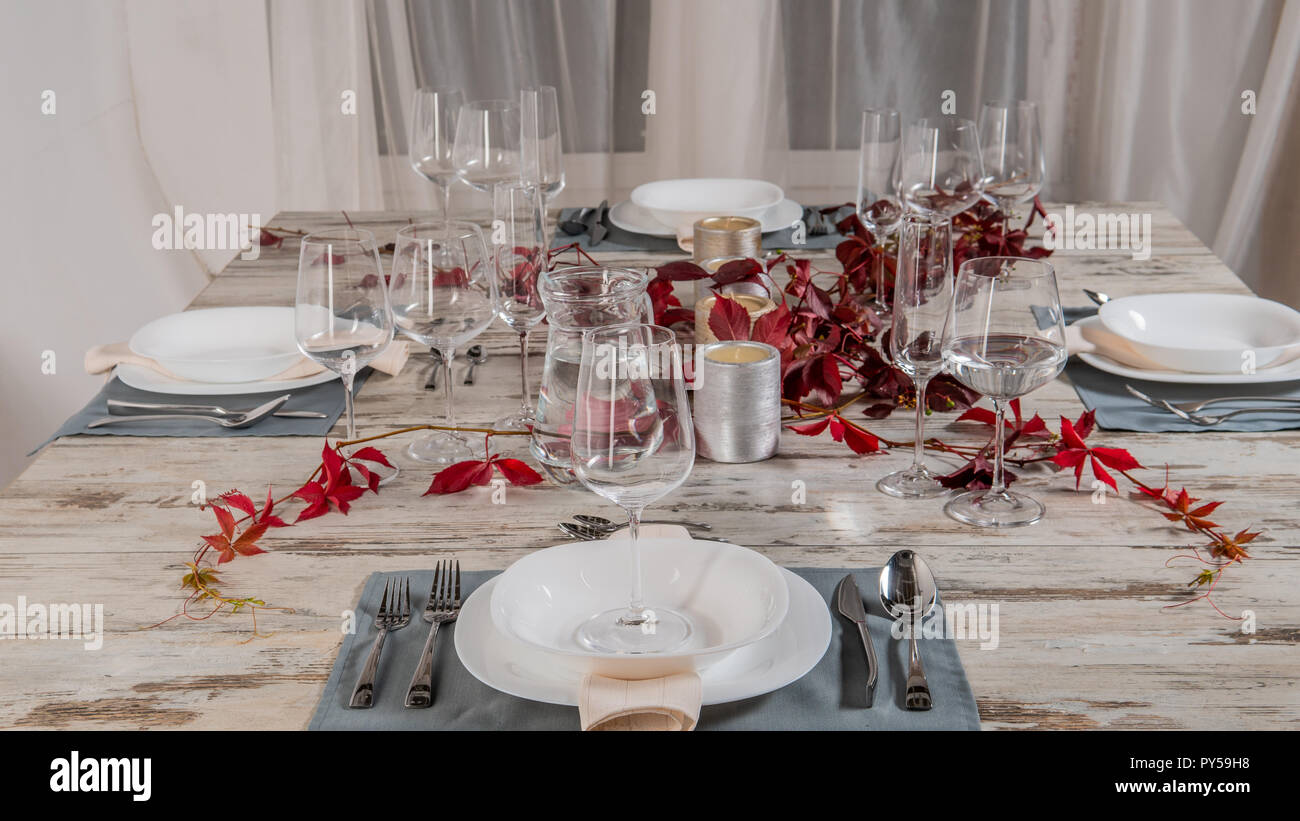 white plate table setting on wooden table. Stock Photo