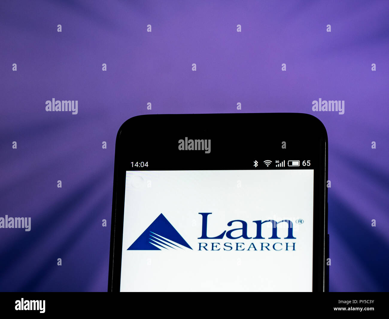 Lam Research Corporation logo seen displayed on smart phone. Lam Research Corporation is an American corporation that engages in the design, manufacture, marketing, and service of semiconductor processing equipment used in the fabrication of integrated circuits. Stock Photo