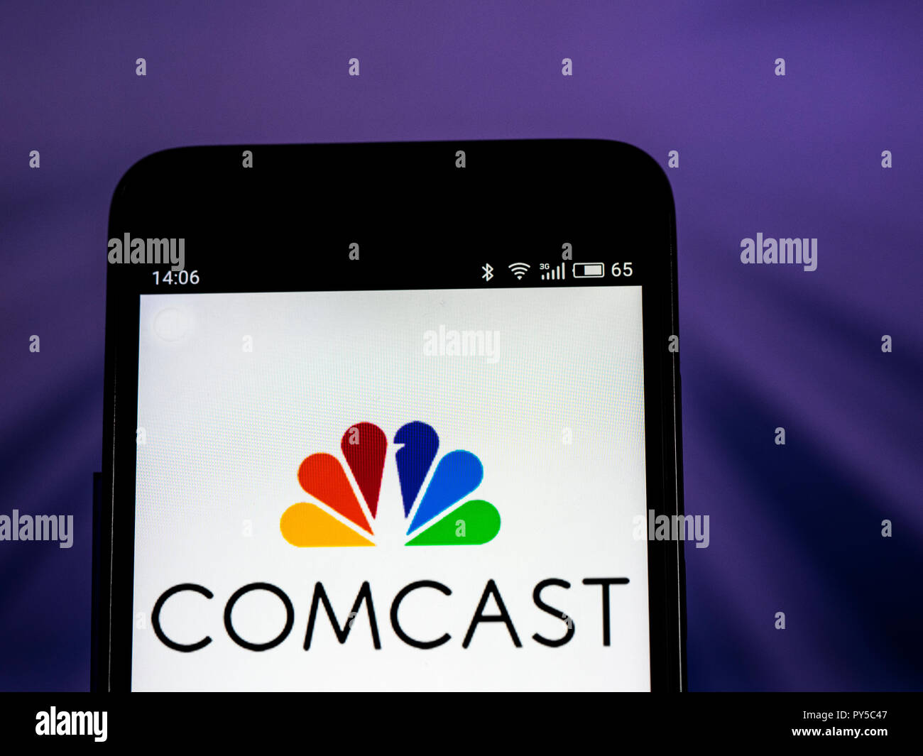 Comcast Telecommunications company logo seen displayed on smart phone. Comcast Corporation is an American global telecommunications conglomerate headquartered in Philadelphia, Pennsylvania. Stock Photo