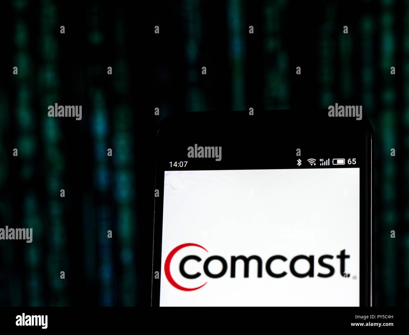 Comcast Telecommunications company logo seen displayed on smart phone. Comcast Corporation is an American global telecommunications conglomerate headquartered in Philadelphia, Pennsylvania. Stock Photo