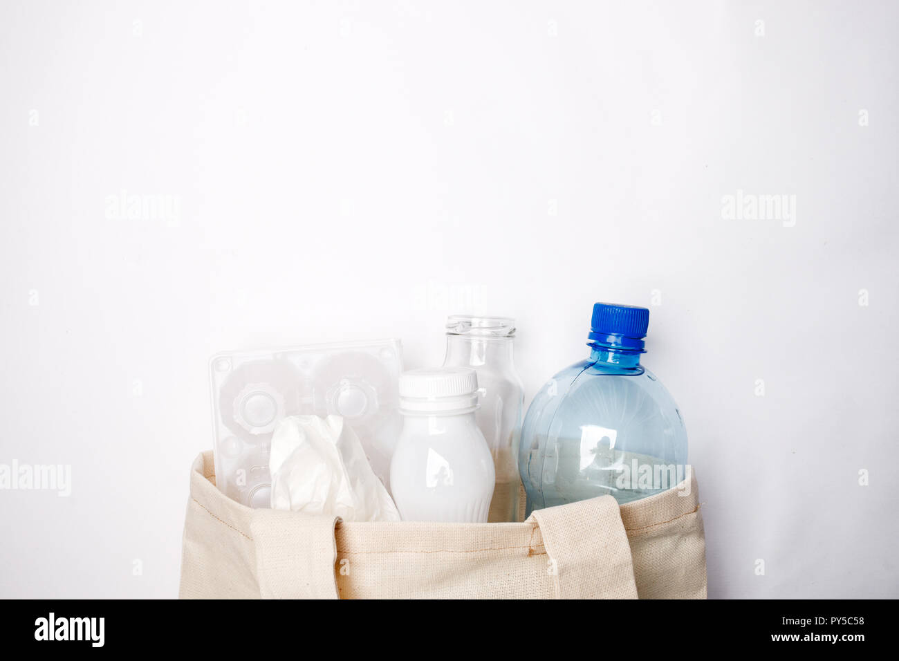 Composition with eco tissyue bag, paper, used box for eggs, packages