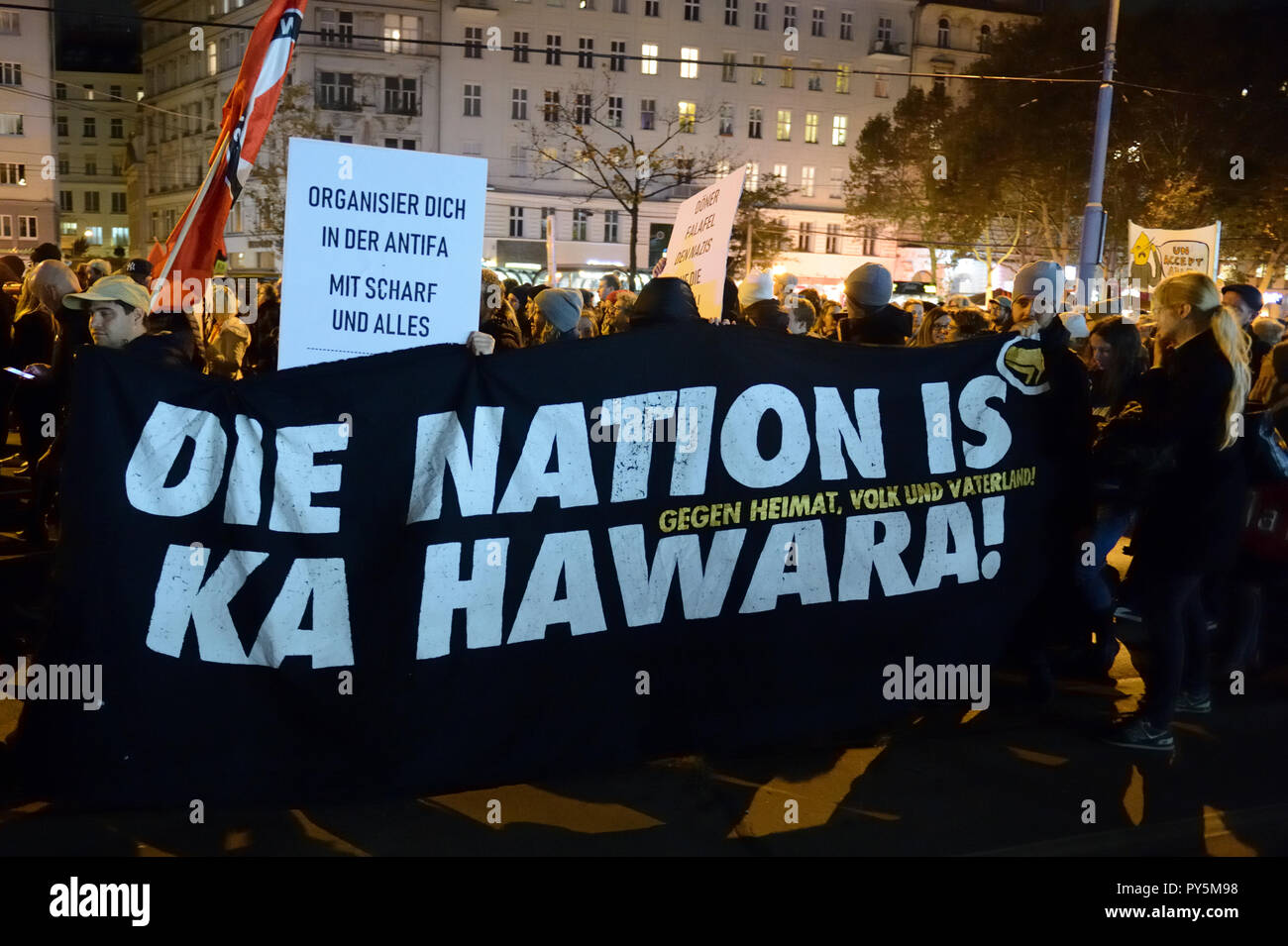 Vienna, Austria. October 25, 2018. The Thursday demonstrations against the current Federal Government are reactivated. The rally was called on Schwedenplatz. The protests will then be continued every week at various locations in Vienna. Picture shows a poster with the inscription 'Organize yourself in the ANTIFA, with sharp and everything'. Credit: Franz Perc / Alamy Live News Stock Photo
