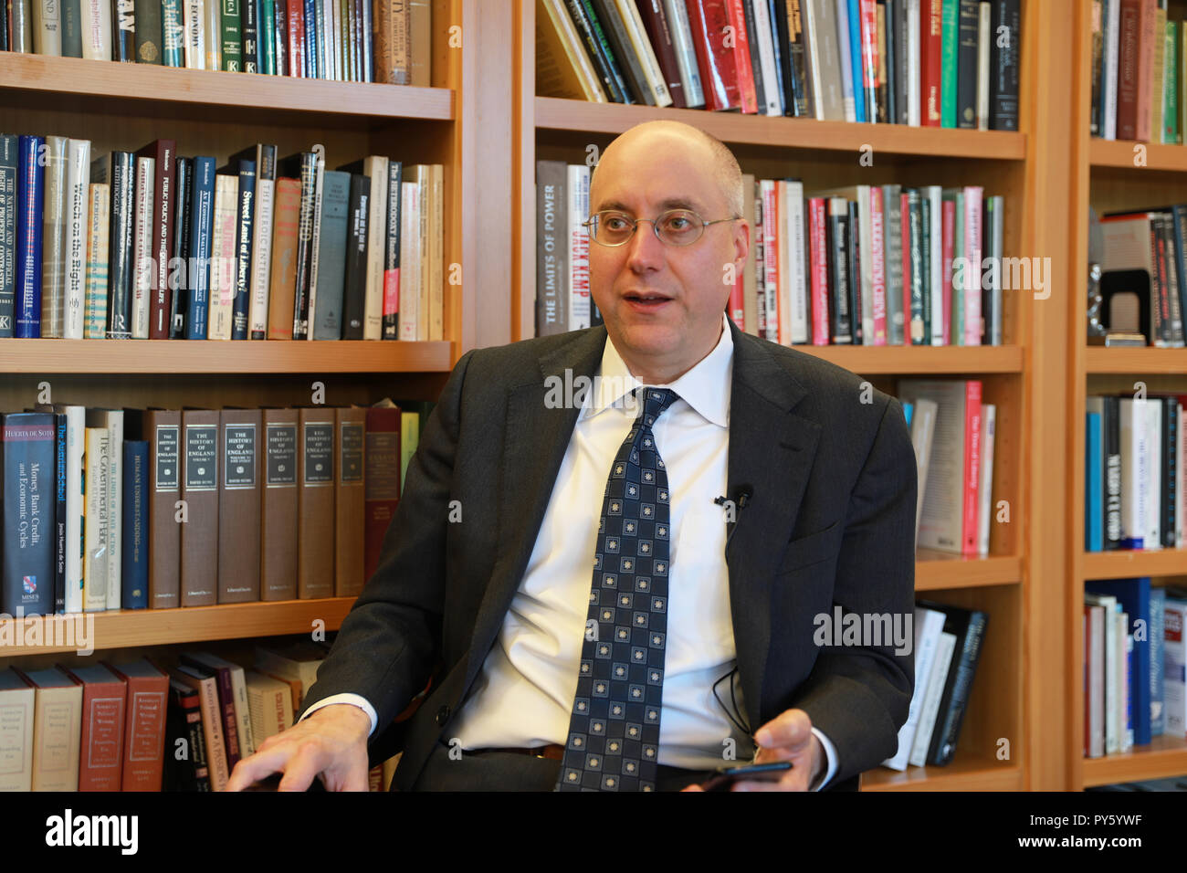 New York, USA. 18th Oct, 2018. Simon Lester, associate director with Herbert A. Stiefel Center for Trade Policy Studies under Cato Institute, receives an interview with Xinhua in Washington, DC, the United States, on Oct. 18, 2018. The settlement of trade tensions between the United States and China requires the willingness and trust from both sides, trade experts and economists said. TO GO WITH Spotlight: Good faith, trust required to settle U.S.-China trade disputes. Credit: Zhang Yichi/Xinhua/Alamy Live News Stock Photo