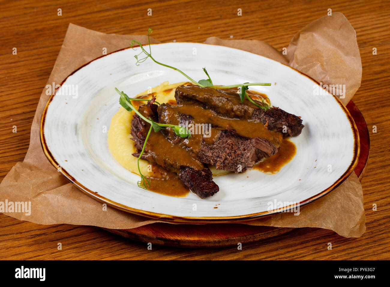 Roasted beef with gravy and mashed potato Stock Photo Alamy