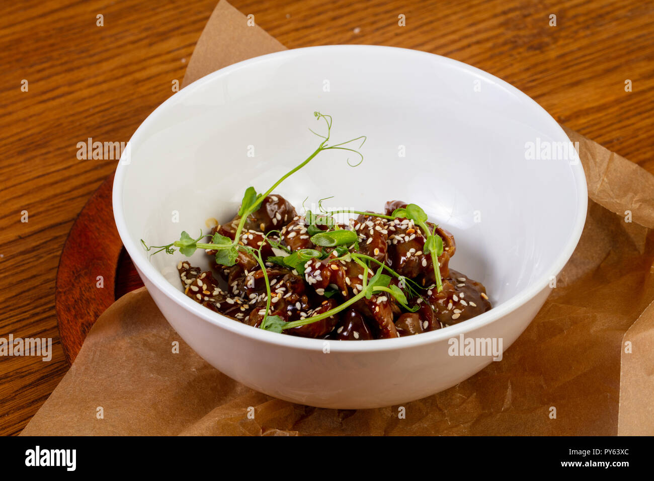 Roasted chicken giblets served sesam seeds Stock Photo Alamy