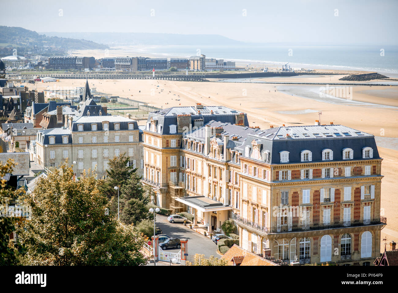 Luxury houses on the coastline with beautiful beach on the background in Trouville, famous french town in Normandy Stock Photo