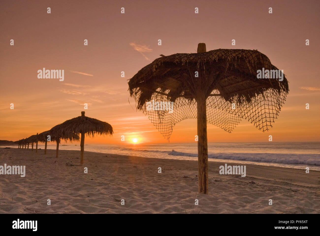 Palapas on Gulf of California (Sea of Cortez) beach at sunrise near Punta Gorda, Eastern Cape area, Baja California Sur, Mexico Stock Photo