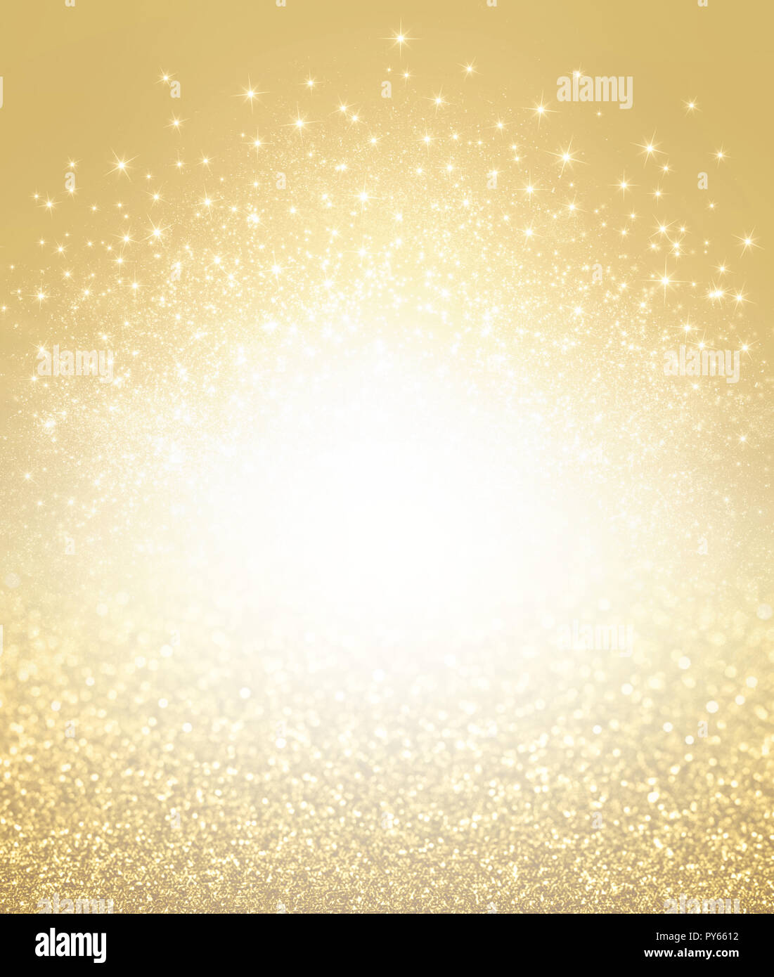 Glittering defocused gold background with shining stars exploding - Festive material Stock Photo