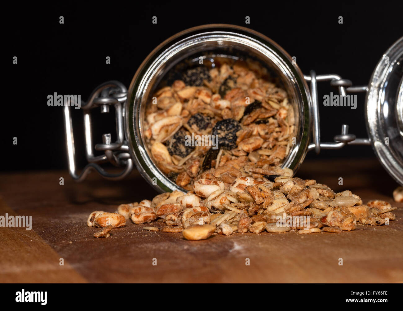Cereals in a glass jar on a wooden table. The concept of a healthy diet, weight loss, diet. Stock Photo