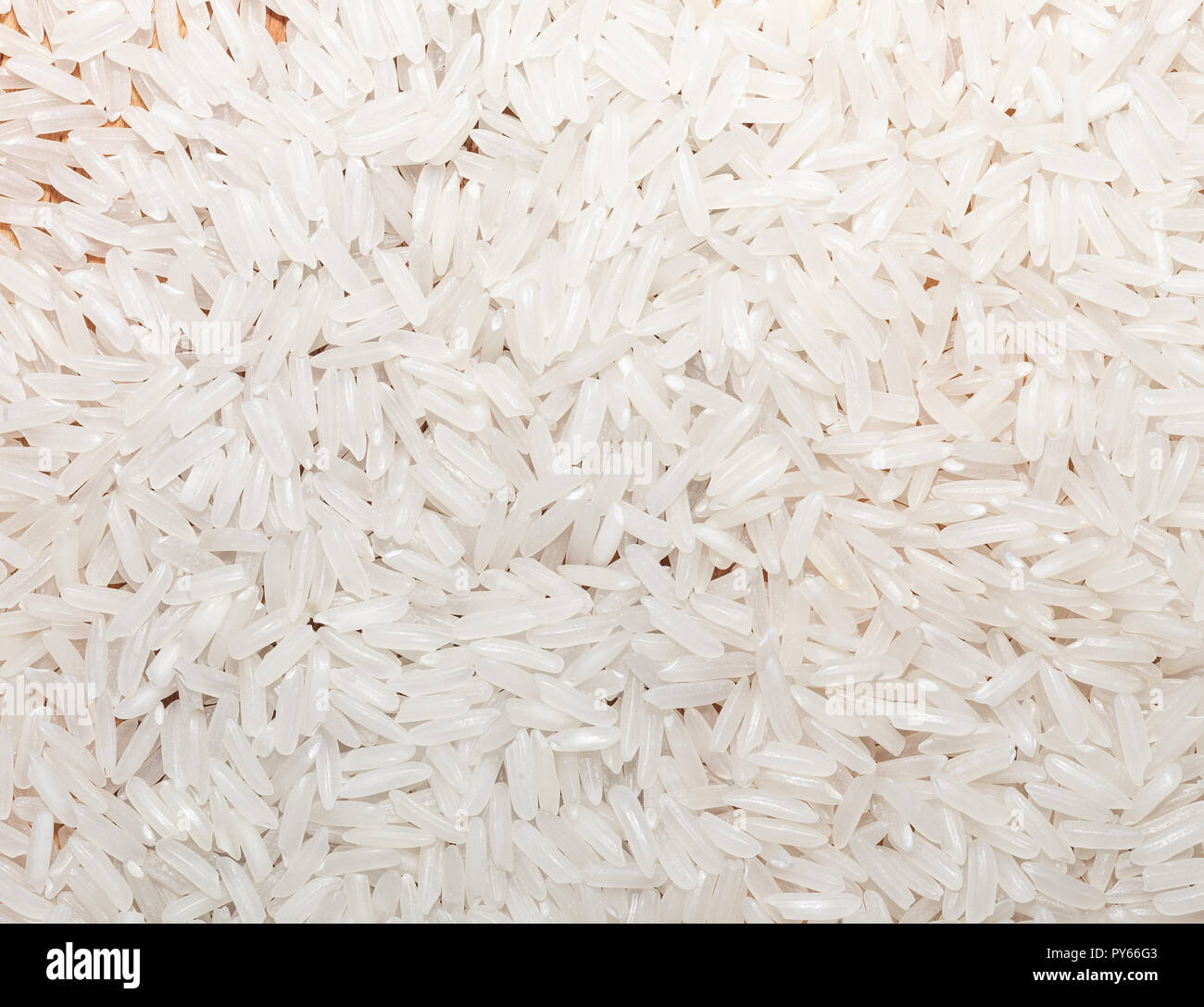 Asian white rice or uncooked. Food background Stock Photo - Alamy